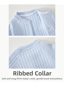Detail of baby light blue jumpsuit piped neckline with soft ribbed texture and snap buttons