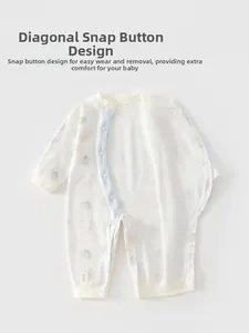 Detail showing side-opening snap buttons on soft cotton long sleeve baby bodysuit