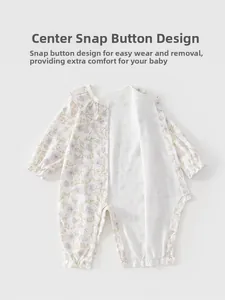 Detail of baby floral romper showing convenient front snap buttons and soft cotton fabric