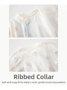 Close-up of baby romper bound neckline with soft snap buttons and cartoon elephant prints