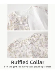 Close-up of baby floral romper neckline with delicate ruffled trim and soft cotton fabric
