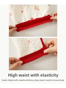 Detailed view of high elastic waistband and double-stitched cuffs on quilted baby suit