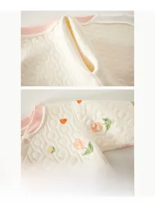 Detail of baby quilted cotton thermal wear showing seamless stitching and soft heart patterns