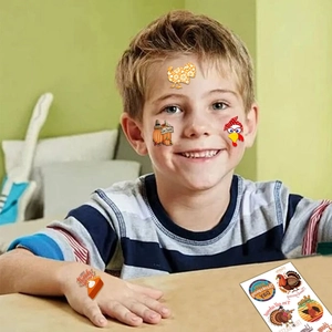 Kids Thanksgiving temporary tattoos with turkey and pumpkin designs for face and hand decor
