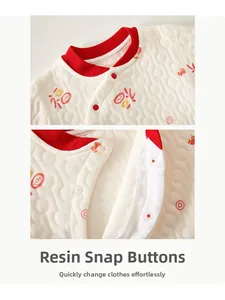Detail of baby quilted thermal top with Chinese characters and resin snap buttons