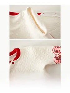 Detail view of seamless stitching and quilted cotton texture on infant warm winter clothes