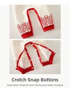 Detailed macro view of baby quilted cotton pants showing snap button closure and Fu character