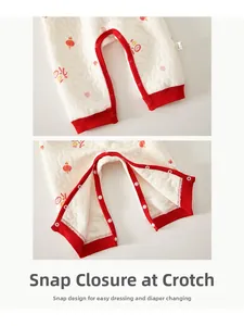 Detail of snap button crotch on quilted baby romper with traditional Chinese festive patterns