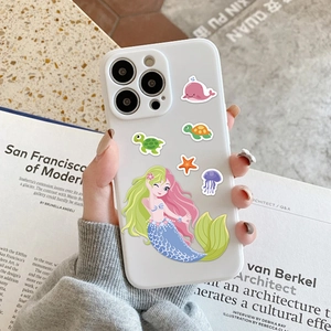 Detail of white silicone iPhone Pro case featuring colorful cartoon mermaid and sea creatures
