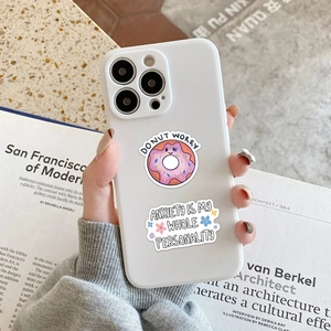 White silicone phone case featuring Donut Worry graffiti stickers and anxiety slogans