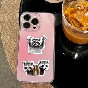 Detail of cute raccoon waterproof stickers on a gradient pink phone case on a desk