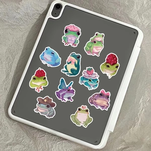 Detailed view of creative waterproof frog stickers applied on a white tablet case