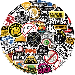 Detailed scattered view of waterproof hard hat stickers with safety slogans and warning signs
