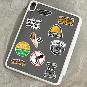 Detail shot of waterproof hard hat stickers on tablet back with bold slogans and designs