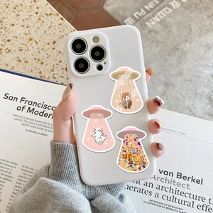 Detailed view of UFO animal cartoon illustrations on a white protective phone case