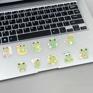 Lot de dix autocollants mignons de grenouille décorant un ordinateur argenté