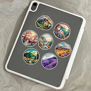 Close-up of scenic landscape stickers on tablet case showing waterproof texture