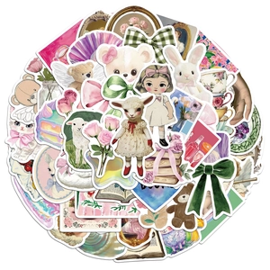 Detailed view of vintage illustration stickers with rabbits, bears, and floral patterns
