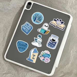 Waterproof blue bookish stickers for laptops and water bottles showing cozy reading themes