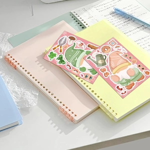 Detail of cute cartoon gnome sticker sheets with gardening and floral themes on a notebook
