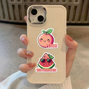 Detail of cream phone case featuring cute cartoon peach and watermelon fruit stickers