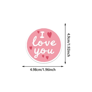 Detailed view showing a 1.96-inch round Valentine sticker with pink I love you text
