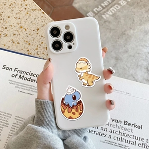 Close-up of matte white silicone phone case featuring cute cartoon dinosaur patterns