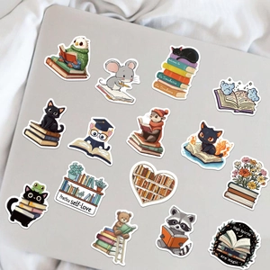 Cute cartoon animal reading stickers on a laptop including owl and raccoon designs