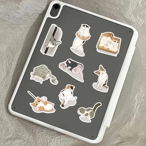Application of cute hand-drawn cartoon cat stickers on a grey tablet surface