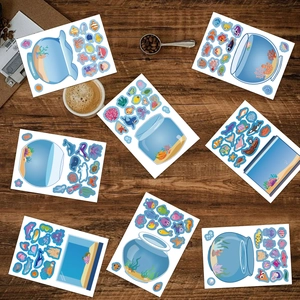 Detail of ocean DIY sticker set with colorful sea creatures and fish tank shapes on wood