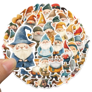 Close-up of hand holding a watercolor gnome sticker showing precise die-cut edges
