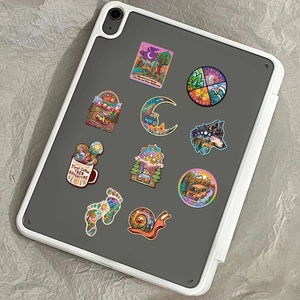 Outdoor camping stickers shown on the back of a tablet for luggage and gear decoration