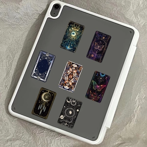 Gothic mystic stickers featuring astrology and moon phases applied to a tablet case