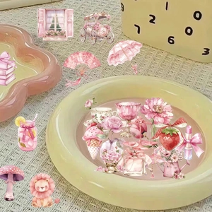 Close-up of pink PET stickers featuring flowers, cats, and decorative girlhood items
