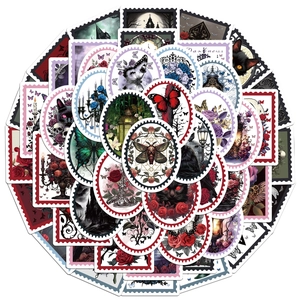 Close-up of Gothic stamp stickers featuring dark moths, skulls, and vintage black roses