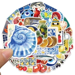 Détail d'autocollants tomate Méditerranée avec coquillages bleus, olives et motif citron
