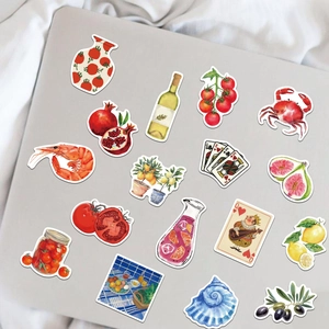 Autocollants de tomates méditerranéennes avec motifs aquarelle sur un ordinateur