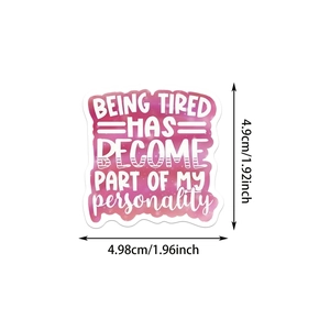 Detail of a purple galactic sticker with sarcastic quotes and white artistic font