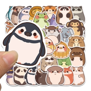 Close-up of cute cartoon plush animal stickers featuring penguin and panda designs