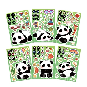 Detailed view of DIY panda dressing sticker sheets with assorted accessories for kids