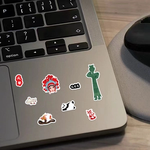 DIY cartoon panda stickers with Sichuan landmarks and Sichuan Opera motifs on a laptop