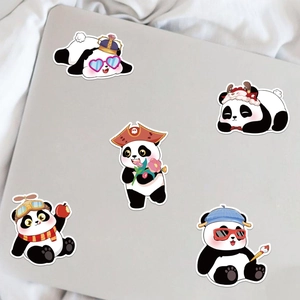 Close-up of five cute cartoon panda stickers with fun accessories on a laptop cover