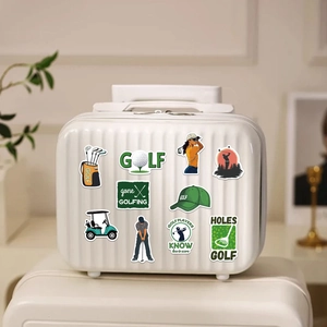 Close-up of assorted golf-themed waterproof vinyl stickers on a white suitcase surface