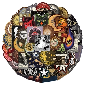Flat lay macro of vintage occult celestial stickers featuring sun moon and tarot patterns