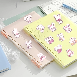 Cute pink bunny stickers set on a notebook for scrapbooking and decoration