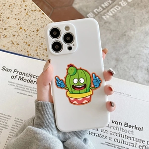 Close-up of a white smartphone case with colorful cartoon cactus prints and vivid details