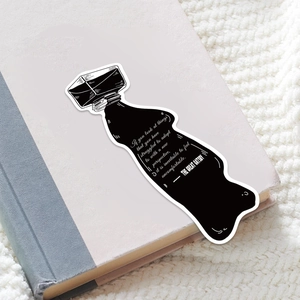 Detailed close-up of ink bottle shaped vintage bookmarks with Great Gatsby literary quotes
