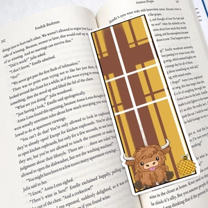 30 Cute Highland Cow bookmarks with plaid pattern placed on an English book page