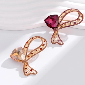 Broches nœuds dorées élégantes avec pierres de cristal champagne et violettes en triangle