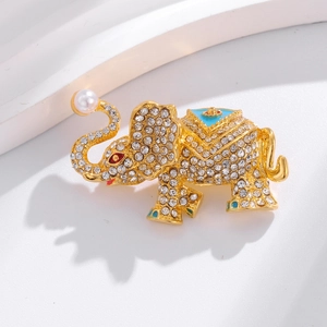 Detailed macro view of elephant brooch with sparkling rhinestones and blue enamel details